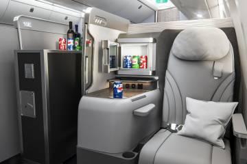 Aircraft cabin equipped with Collins Aerospace's SpaceChiller in-seat mini bar