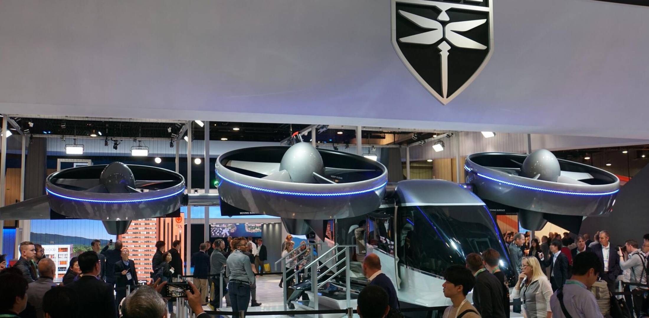 The Nexus 4EX eVTOL aircraft on display and surrounded by attendees at the Customer Electronics Show show in Las Vegas in January of 2020.