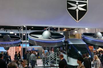The Nexus 4EX eVTOL aircraft on display and surrounded by attendees at the Customer Electronics Show show in Las Vegas in January of 2020.