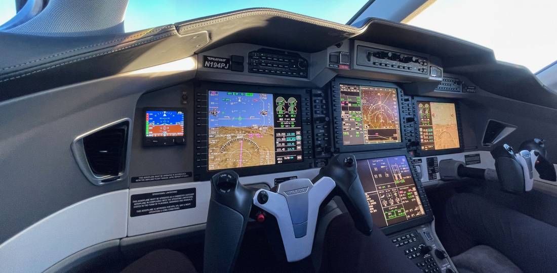 The PC-24 flight deck features a Honeywell Epic-based avionics suite, cursor-control device interface, and autothrottles.