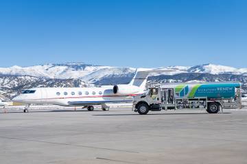Signature Flight Support Fuel truck alongside a business jet on the airport ramp in Vail, Colorado