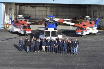 Photo of Summit Aviation team and helicopters outside hangar