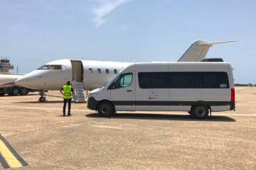 Universal Aviation/Andalucia Aviation mobile service van parked next to business jet in Menorca