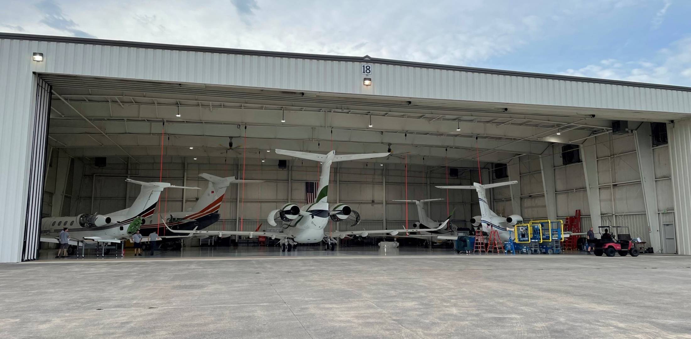 West Star Aviation Embraer support center hangar with business jets parked inside